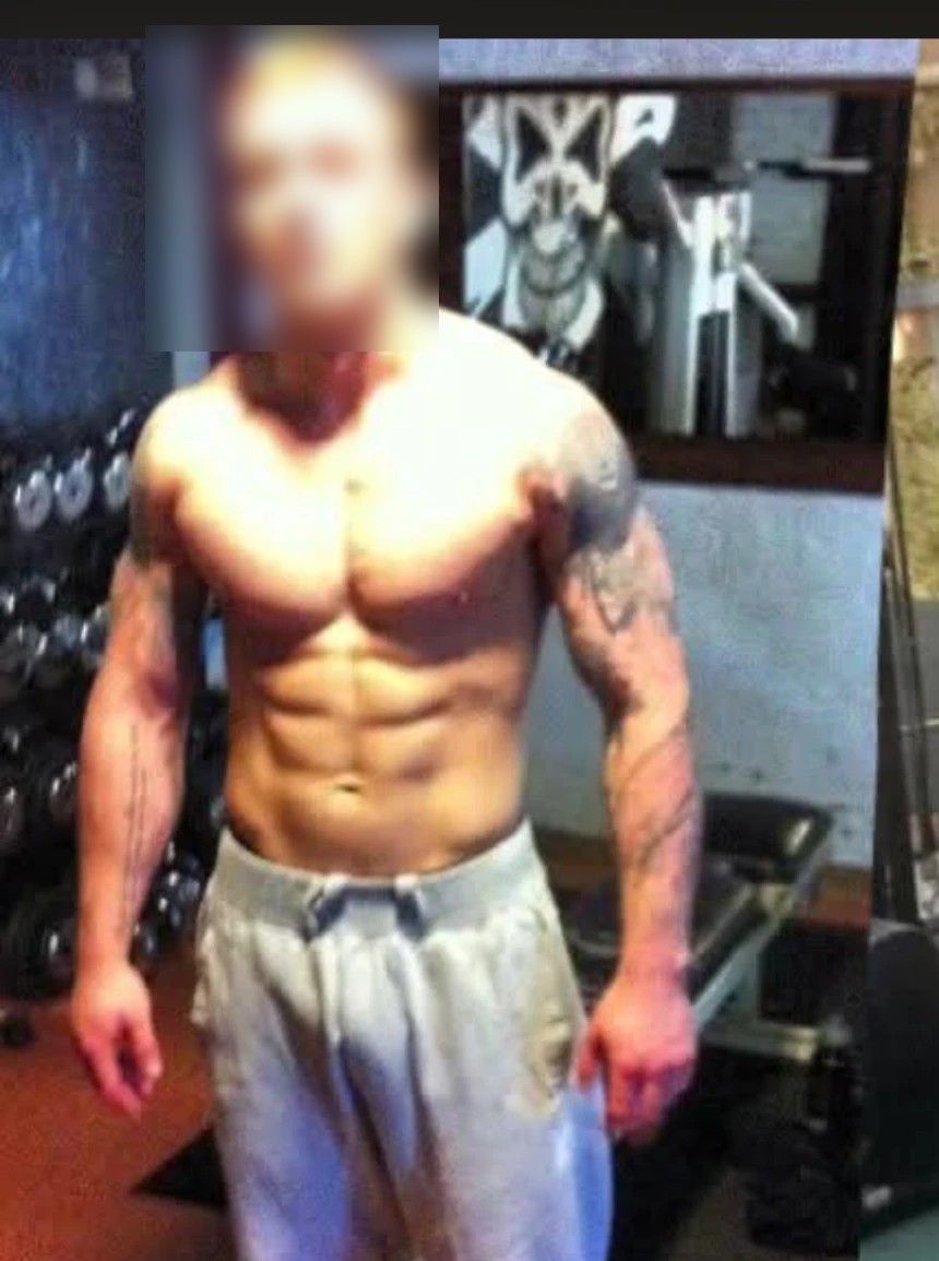 A client displaying muscular definition after coached training, face blurred