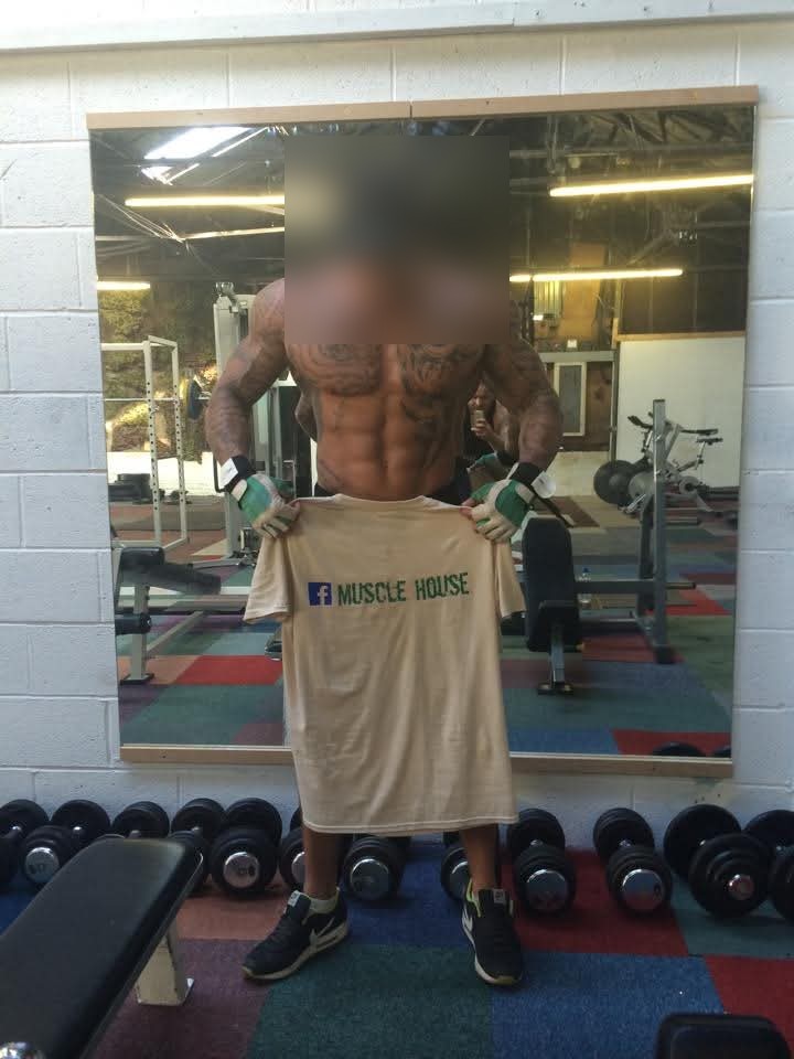 A client showing defined muscular condition, face blurred