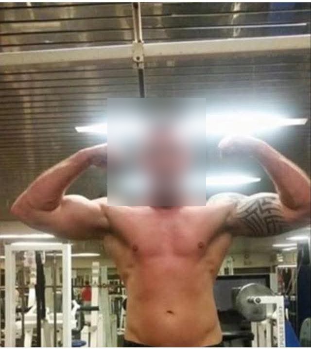 A client's early muscle definition progress, face blurred